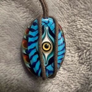Evil Eye Colorful Glass Pendant on a brown cord, excellent condition